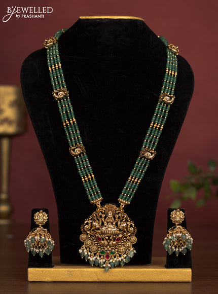 Jadau beaded haaram lakshmi pendant with jadau kemp stones and pearl & green beads hanging