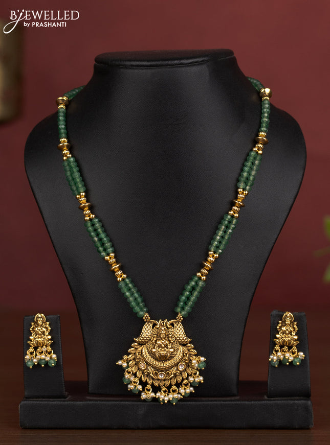 Antique beaded necklace lakshmi pendant with kundan stones and pearl & green beads hanging