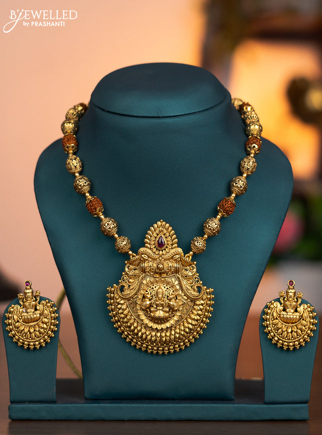 Antique rudhraksha mala with lakshmi pendant and pink kemp stone