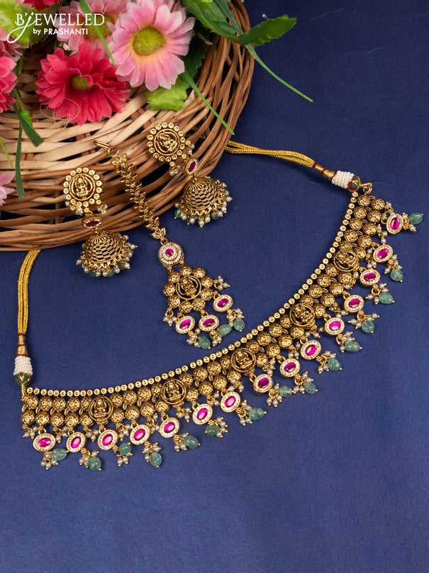 Antique choker lakshmi design with pink jadau kundan stones and pear & golden beads hanging with maang tikka