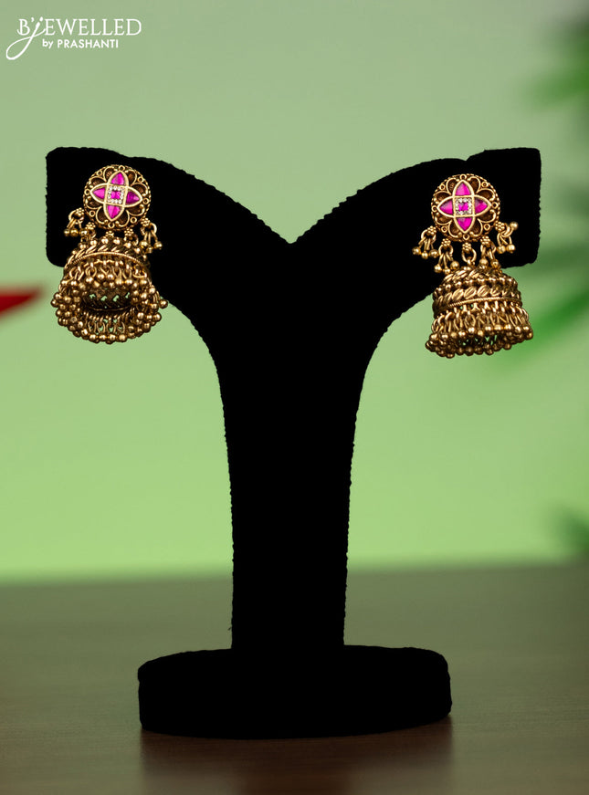 Jadau attigai necklace with pink jadau stones and golden beads hanging