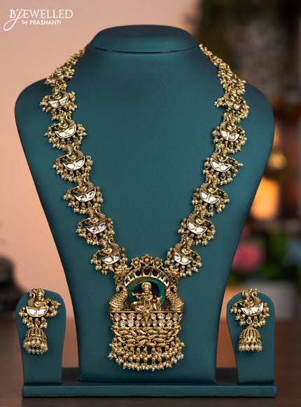 Jadau haaram peacock feather krishna pendant with jadau kundan stones and pearl hanings