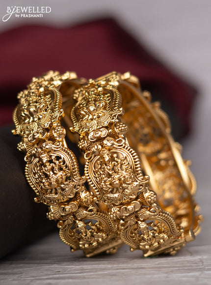 Antique screw type bangle with lakshmi design