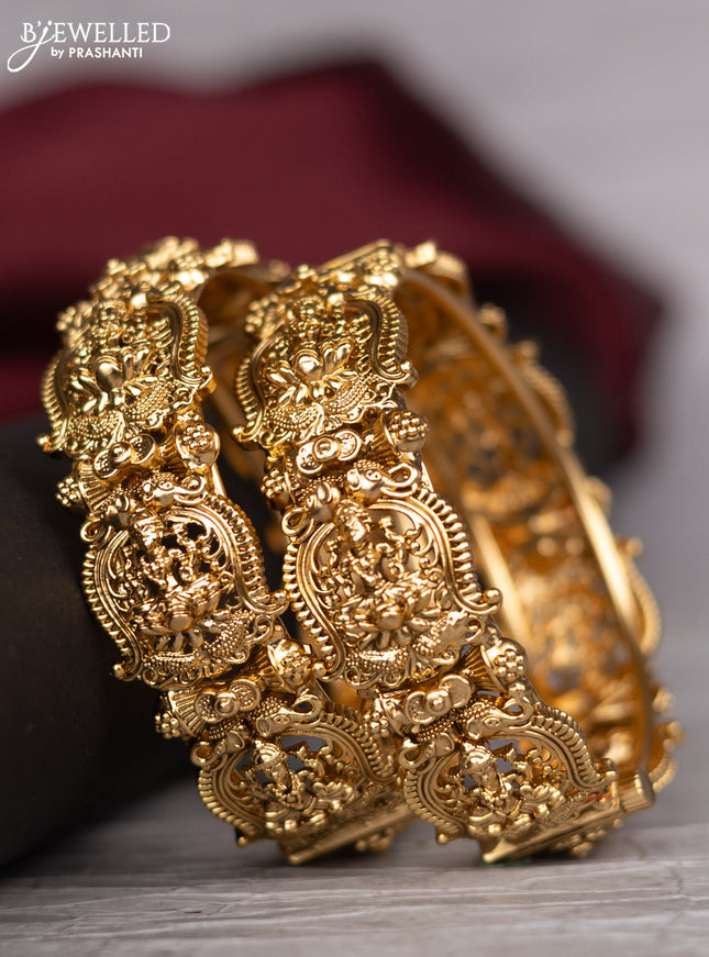 Antique screw type bangle with lakshmi design