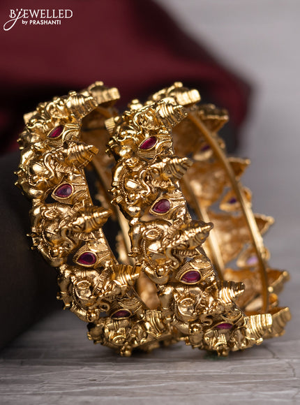 Antique screw type bangle with ganesha design and pink kemp stones