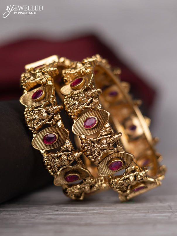 Antique screw type bangle with lakshmi design and pink kemp stones
