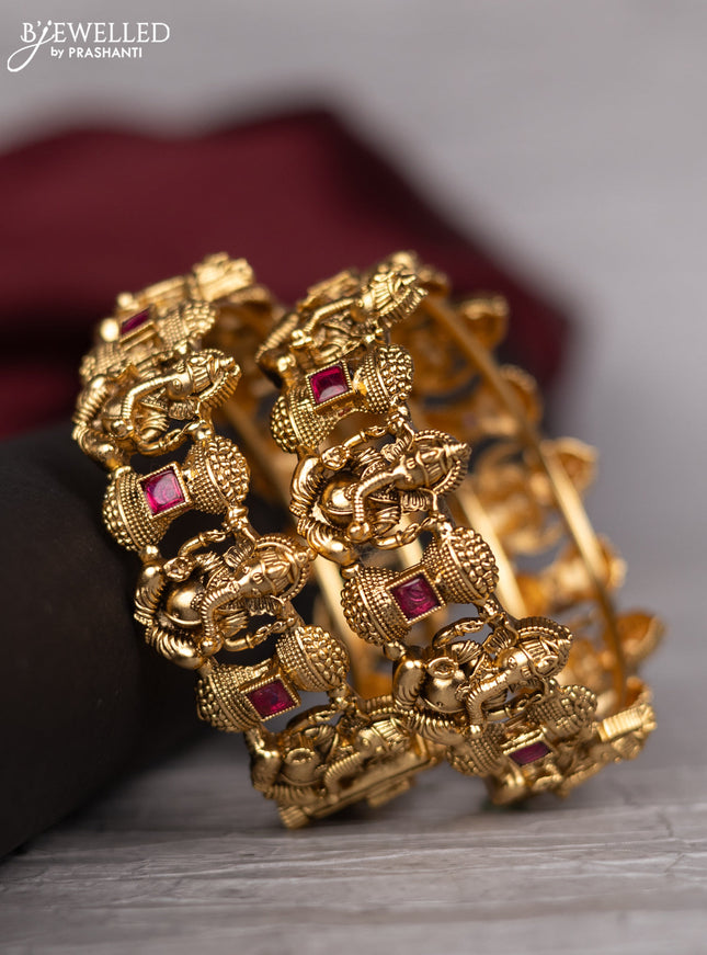 Antique screw type bangle with ganesha design and pink kemp stones