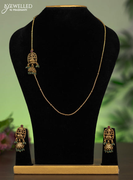 Antique mugappu chain lakshmi pendant with pink kundan stones and green beads hangings