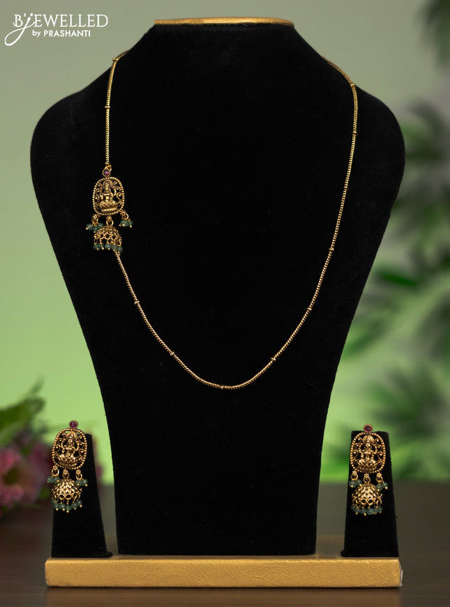 Antique mugappu chain lakshmi pendant with pink kundan stones and green beads hangings