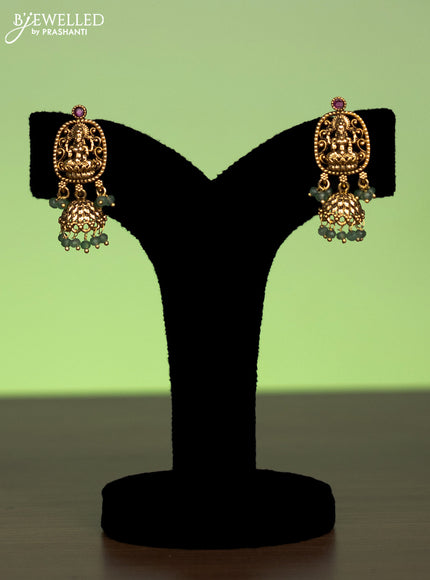 Antique mugappu chain lakshmi pendant with pink kundan stones and green beads hangings