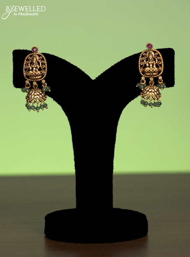 Antique mugappu chain lakshmi pendant with pink kundan stones and green beads hangings