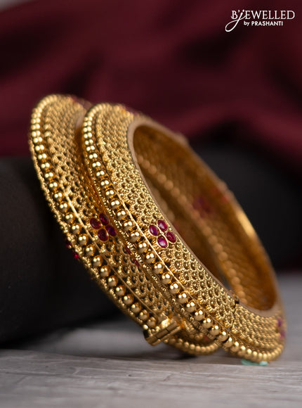 Antique screw type bangles with ruby stones