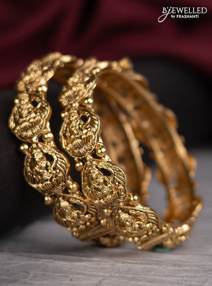Antique screw type bangles with lakshmi design
