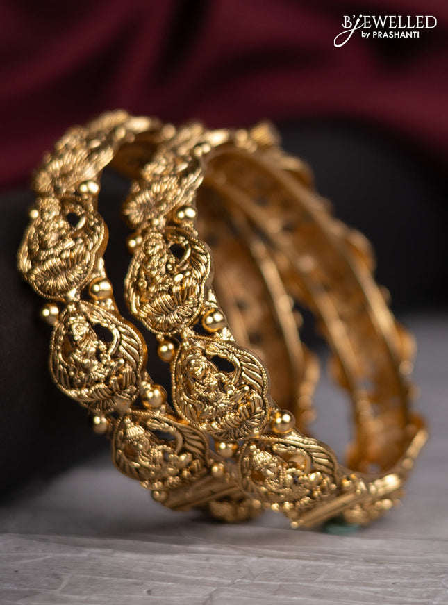 Antique screw type bangles with lakshmi design