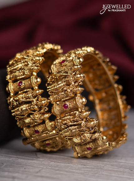 Antique screw type bangles with ram darbar design and ruby stones