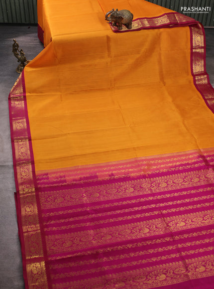 Silk cotton saree mustard yellow and deep wine shade with plain body and zari woven korvai border