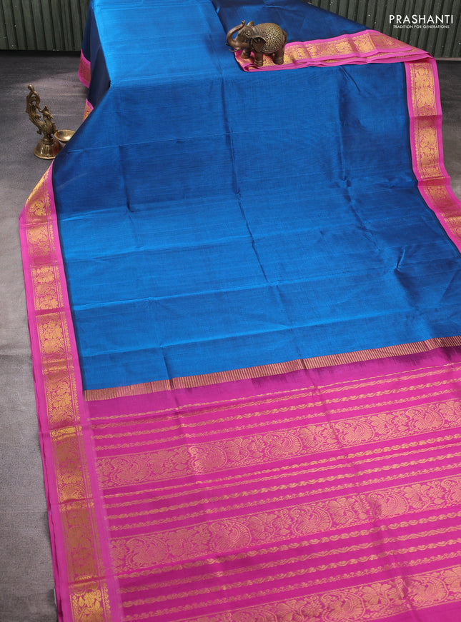 Silk cotton saree peacock blue and pink with plain body and zari woven korvai border