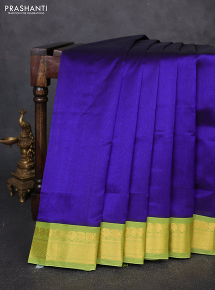 Silk cotton saree violet and light green with plain body and zari woven korvai border