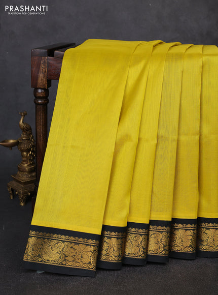 Silk cotton saree lime yellow and bottle green with plain body and zari woven korvai border
