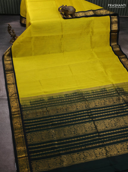 Silk cotton saree lime yellow and bottle green with plain body and zari woven korvai border