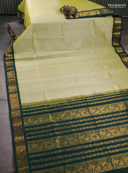 Silk cotton saree pista green and bottle green with plain body and zari woven korvai border