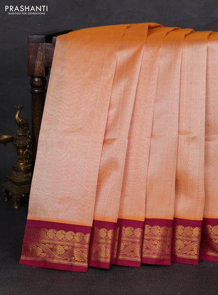 Silk cotton saree pale orange and wine shade with plain body and zari woven korvai border