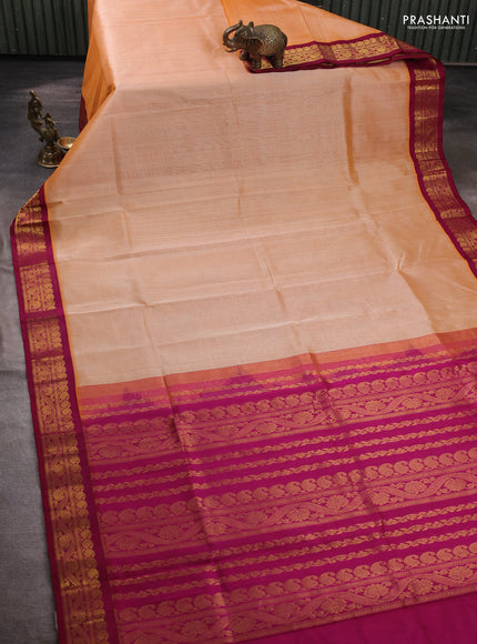 Silk cotton saree pale orange and wine shade with plain body and zari woven korvai border
