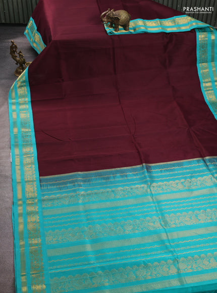 Silk cotton saree coffee brown and teal blue with plain body and zari woven korvai border
