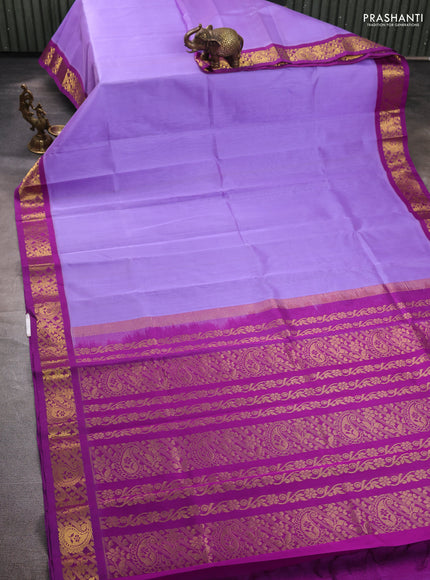 Silk cotton saree lavender and purple with plain body and zari woven korvai border
