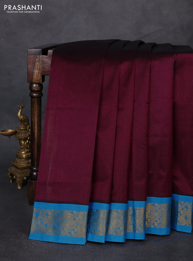 Silk cotton saree deep wine shade and cs blue with plain body and zari woven korvai border