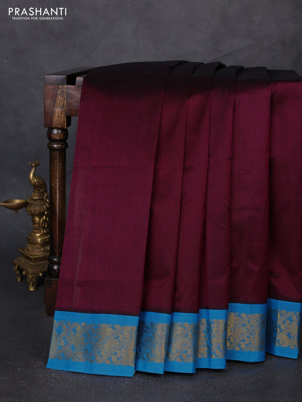Silk cotton saree deep wine shade and cs blue with plain body and zari woven korvai border