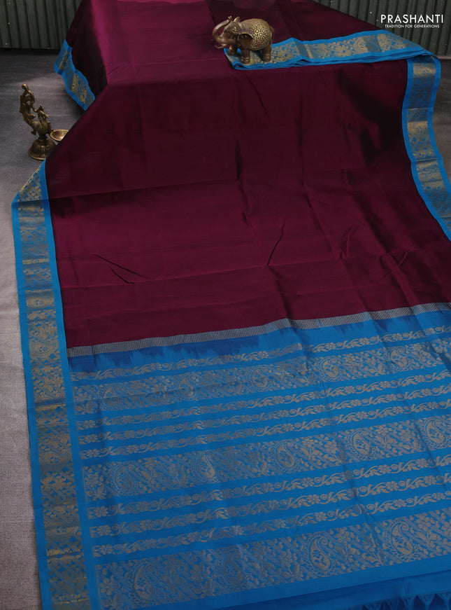 Silk cotton saree deep wine shade and cs blue with plain body and zari woven korvai border