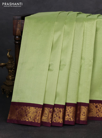 Silk cotton saree pista green and deep wine shade with plain body and zari woven korvai border