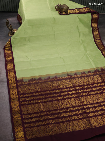 Silk cotton saree pista green and deep wine shade with plain body and zari woven korvai border