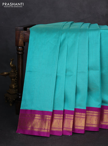 Silk cotton saree teal blue and purple with plain body and zari woven korvai border
