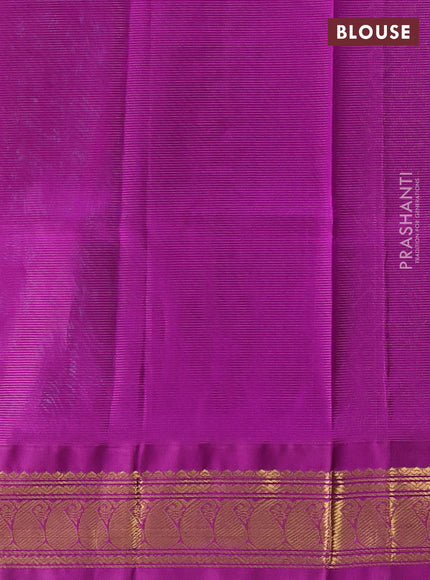 Silk cotton saree teal blue and purple with plain body and zari woven korvai border