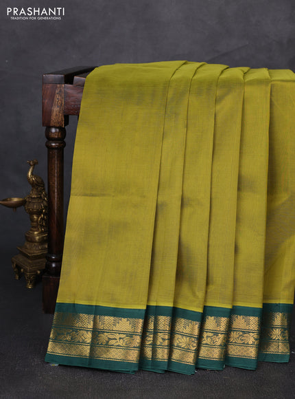 Silk cotton saree mehendi green and green with plain body and temple zari woven korvai border