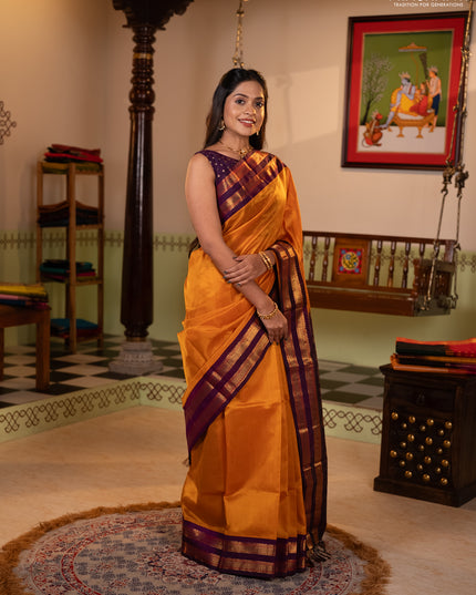Silk cotton saree mustard yellow and purple with plain body and rettapet zari woven korvai border