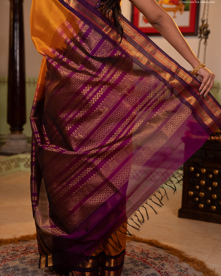 Silk cotton saree mustard yellow and purple with plain body and rettapet zari woven korvai border