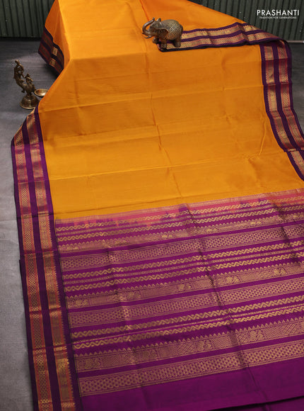 Silk cotton saree mustard yellow and purple with plain body and rettapet zari woven korvai border
