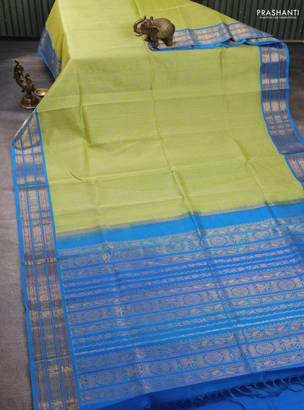 Silk cotton saree pista green and cs blue with allover small checked pattern and temple zari woven korvai border