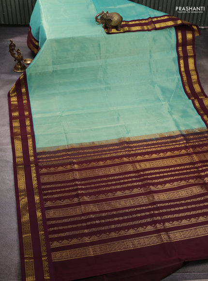 Silk cotton saree teal green and coffee brown with plain body and rettapet zari woven korvai border