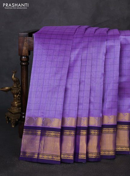 Silk cotton saree lavender and blue with allover checked pattern and zari woven korvai border