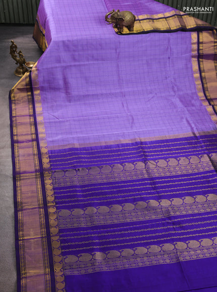 Silk cotton saree lavender and blue with allover checked pattern and zari woven korvai border