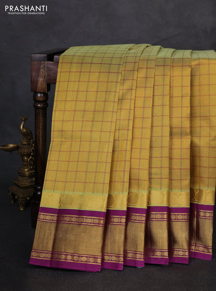 Silk cotton saree dual shade of mustard and purple with allover checked pattern and zari woven korvai border