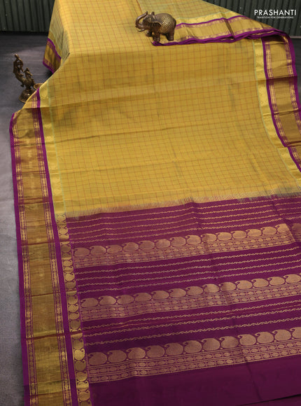 Silk cotton saree dual shade of mustard and purple with allover checked pattern and zari woven korvai border