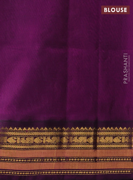 Silk cotton saree bottle green and purple with plain body and temple zari woven korvai border