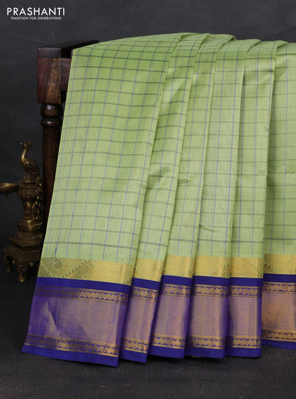 Silk cotton saree pista green and blue with allover checked pattern and temple zari woven korvai border