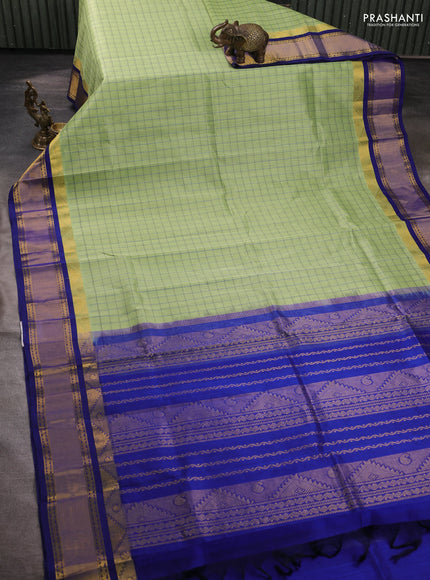 Silk cotton saree pista green and blue with allover checked pattern and temple zari woven korvai border