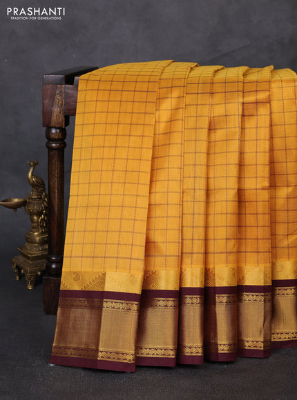 Silk cotton saree mustard yellow and coffee brown with allover checked pattern and temple zari woven korvai border